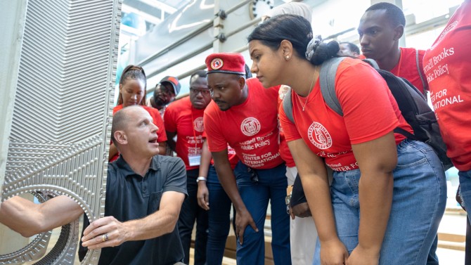 At the Lake Source Cooling facility, fellows learn about Cornell’s efforts to reduce reliance on fossil fuels.
