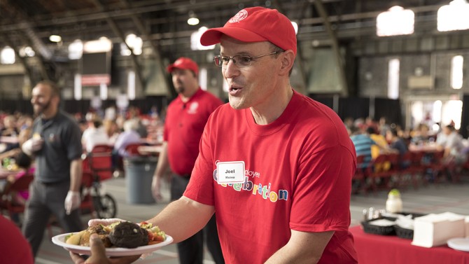 Vice President Joel Malina serves up chicken barbeque