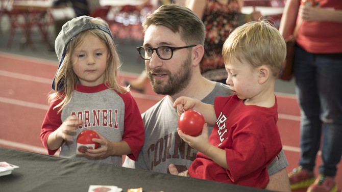 Adam Walden, center, with Olive and Arthur enjoying stress balls