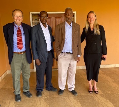 Rachel Beatty Riedl, Nic van de Walle, Muna Ndulo and Manenga Ndulo for a photo.