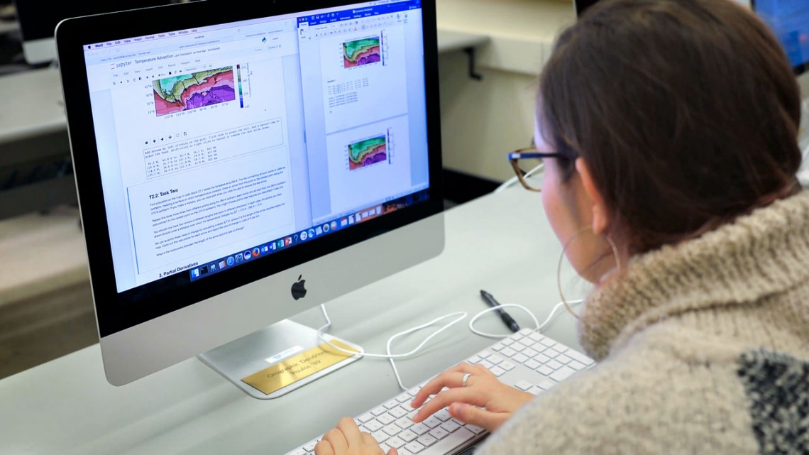 A student works on a Jupyter Notebooks assignment
